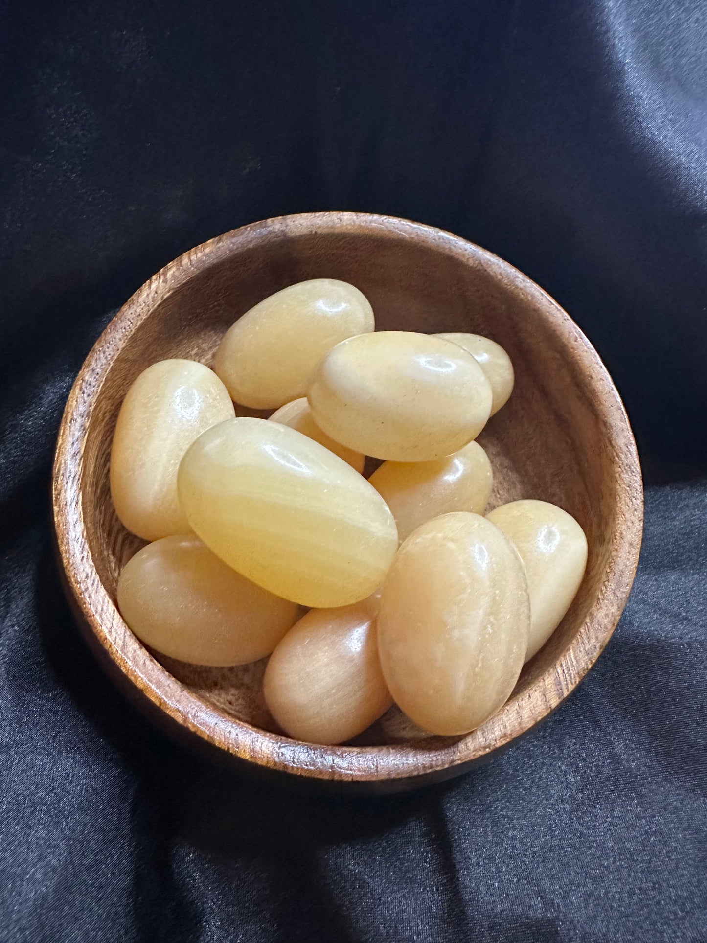 Orange Calcite tumbled stone, warm translucent orange