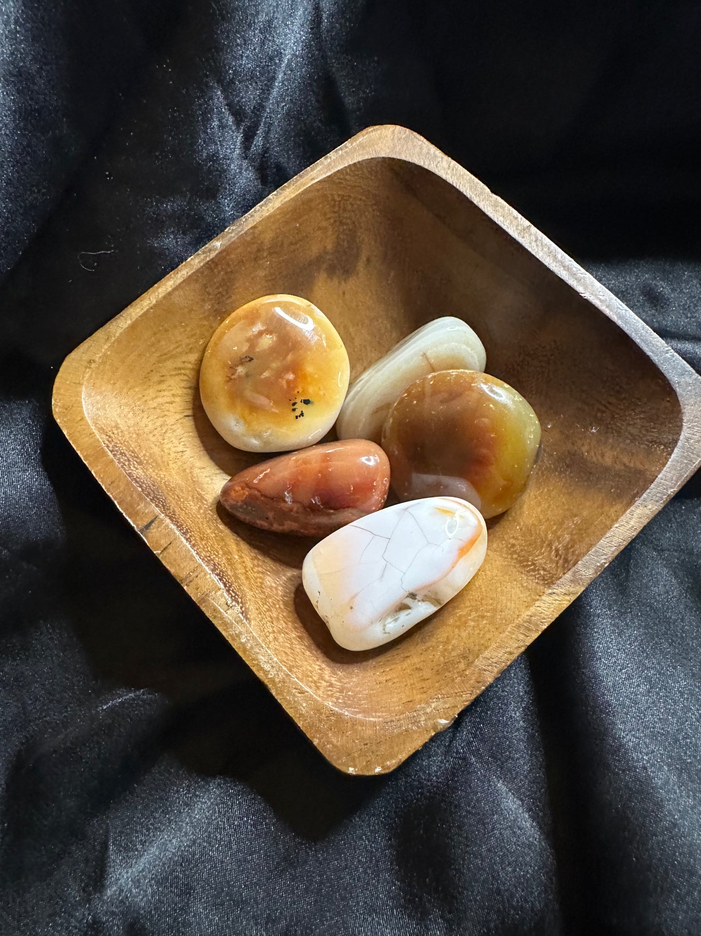 Carnelian tumbled stone, turned to catch the light