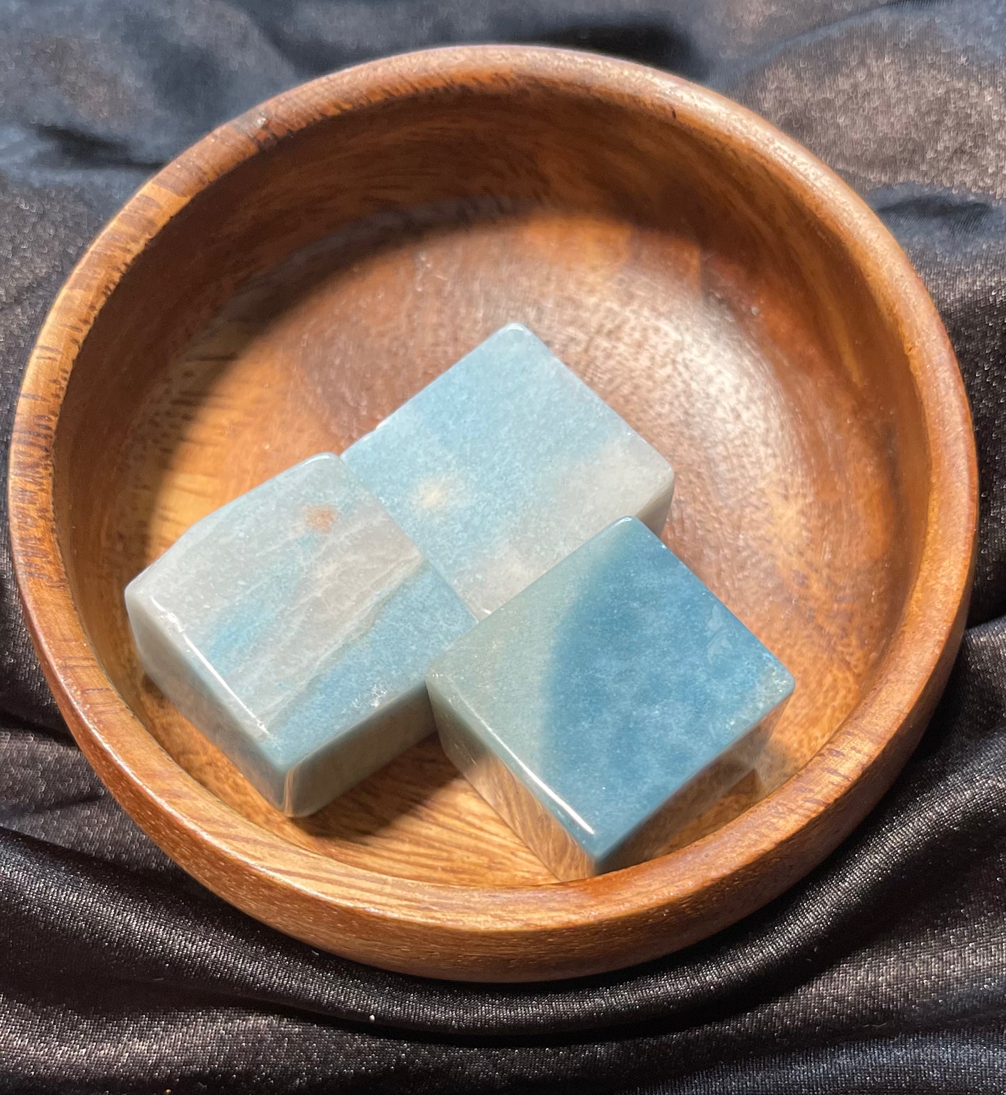 Trolleite crystal cube, held in hand for scale