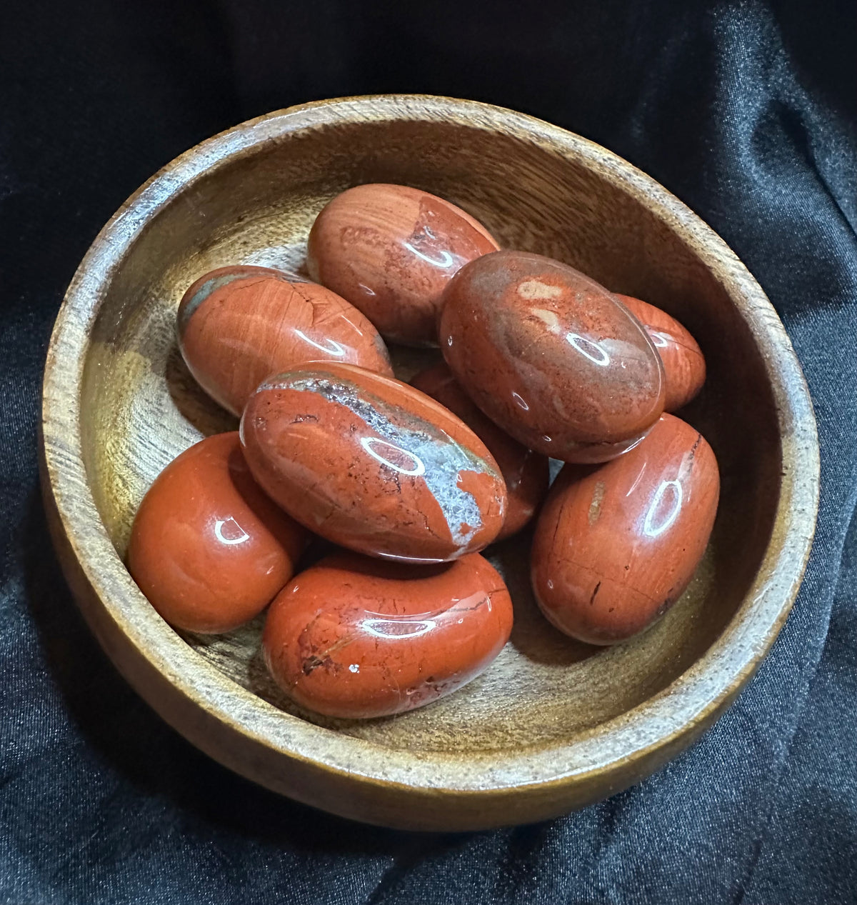 Red Jasper tumbled stone, opaque brick-red, lightly mottled
