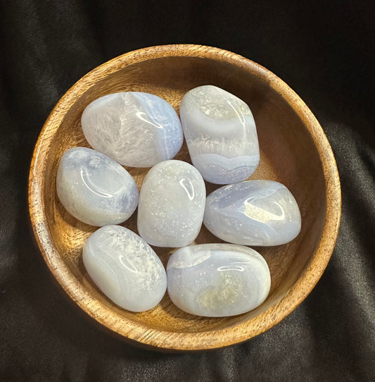 Blue Lace Agate tumbled stone, pale sky-blue with fine white banding