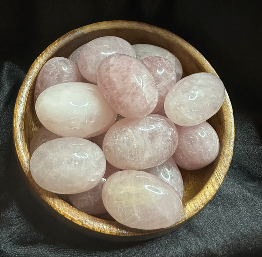 Rose Quartz tumbled stone, soft blush pink, gently translucent