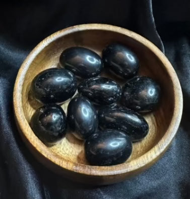 Obsidian tumbled stone, glassy jet-black, smooth