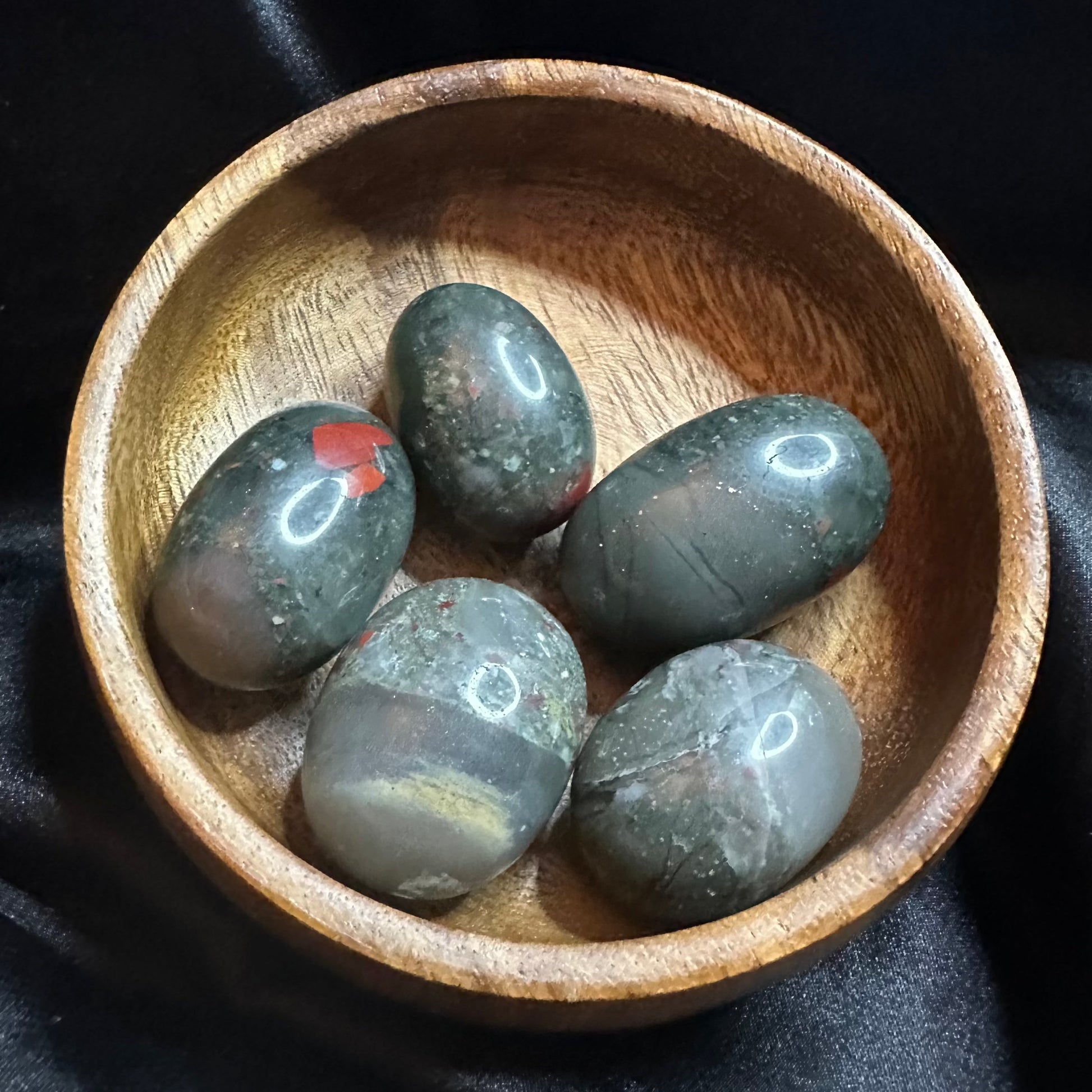 African Bloodstone tumbled stone, dark green flecked with red