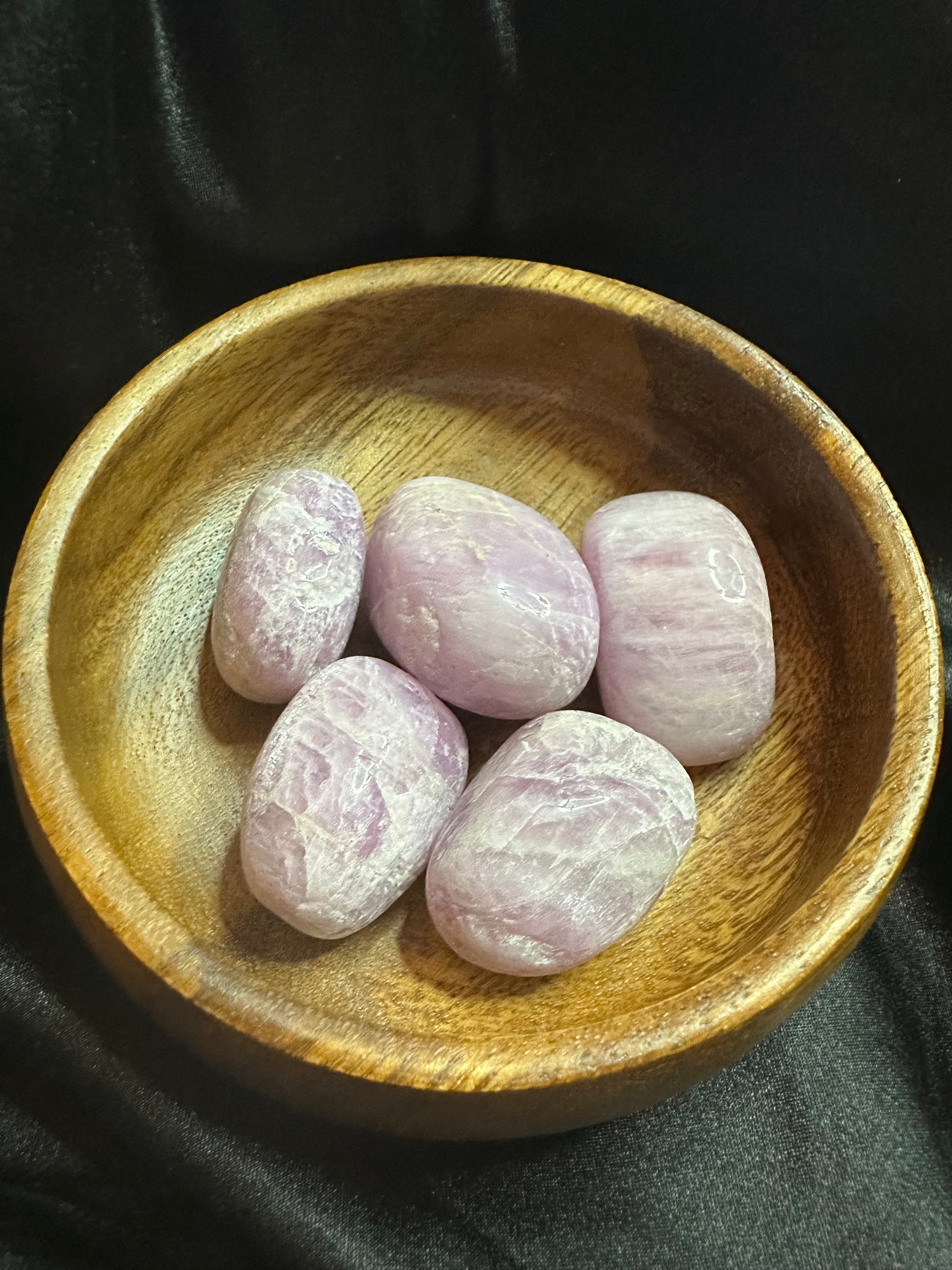 Kunzite tumbled stone, pale pink, lightly translucent with striations