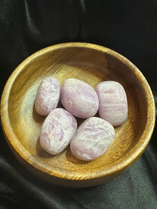 Kunzite tumbled stone, pale pink, lightly translucent with striations