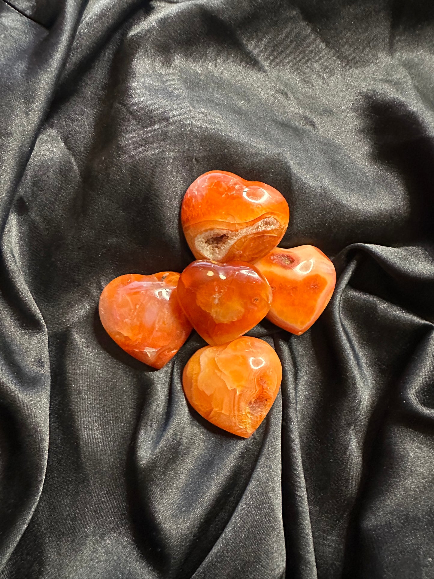 Carnelian crystal heart, warm translucent orange-red