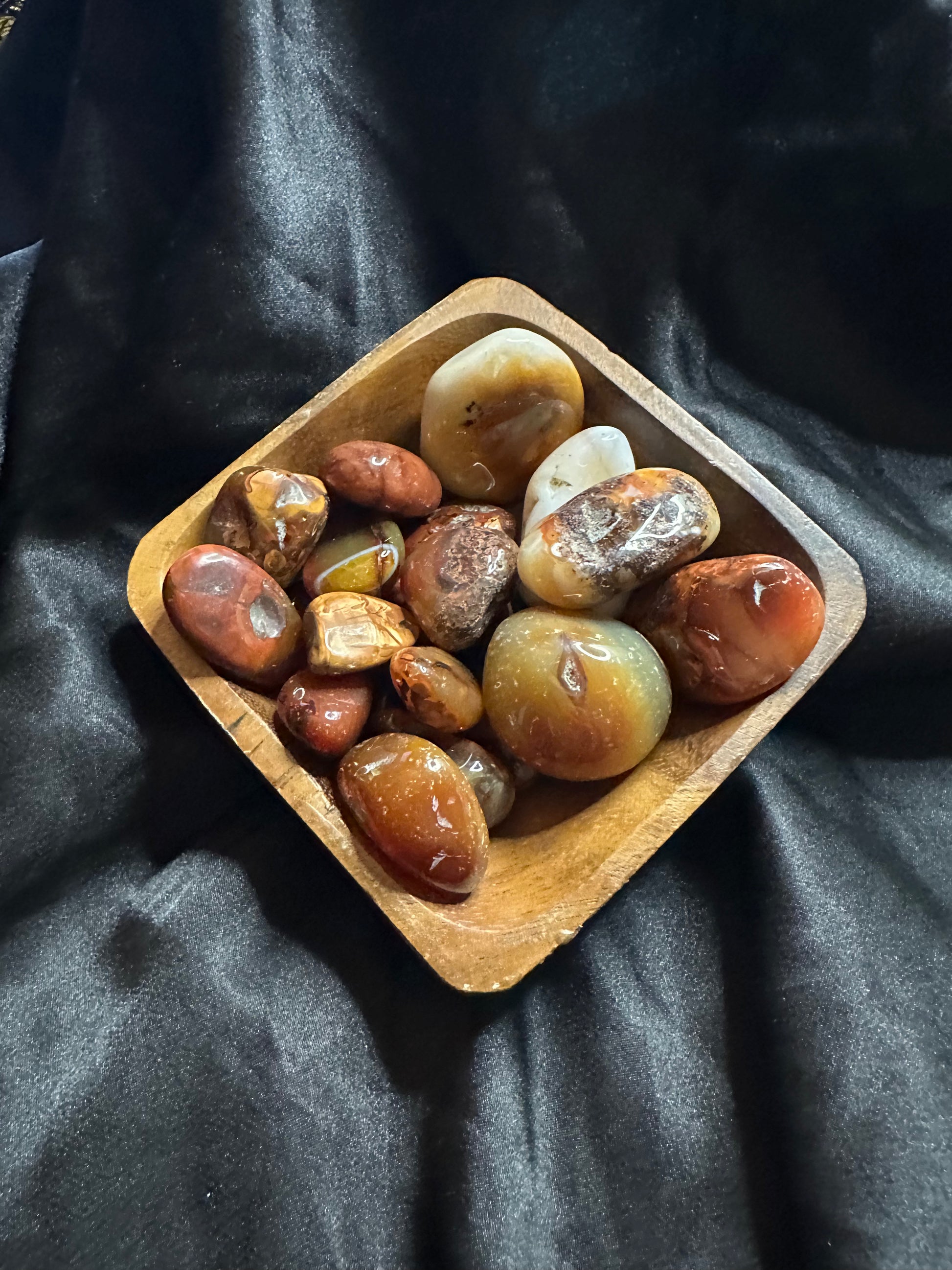 Carnelian tumbled stone, warm translucent orange-red