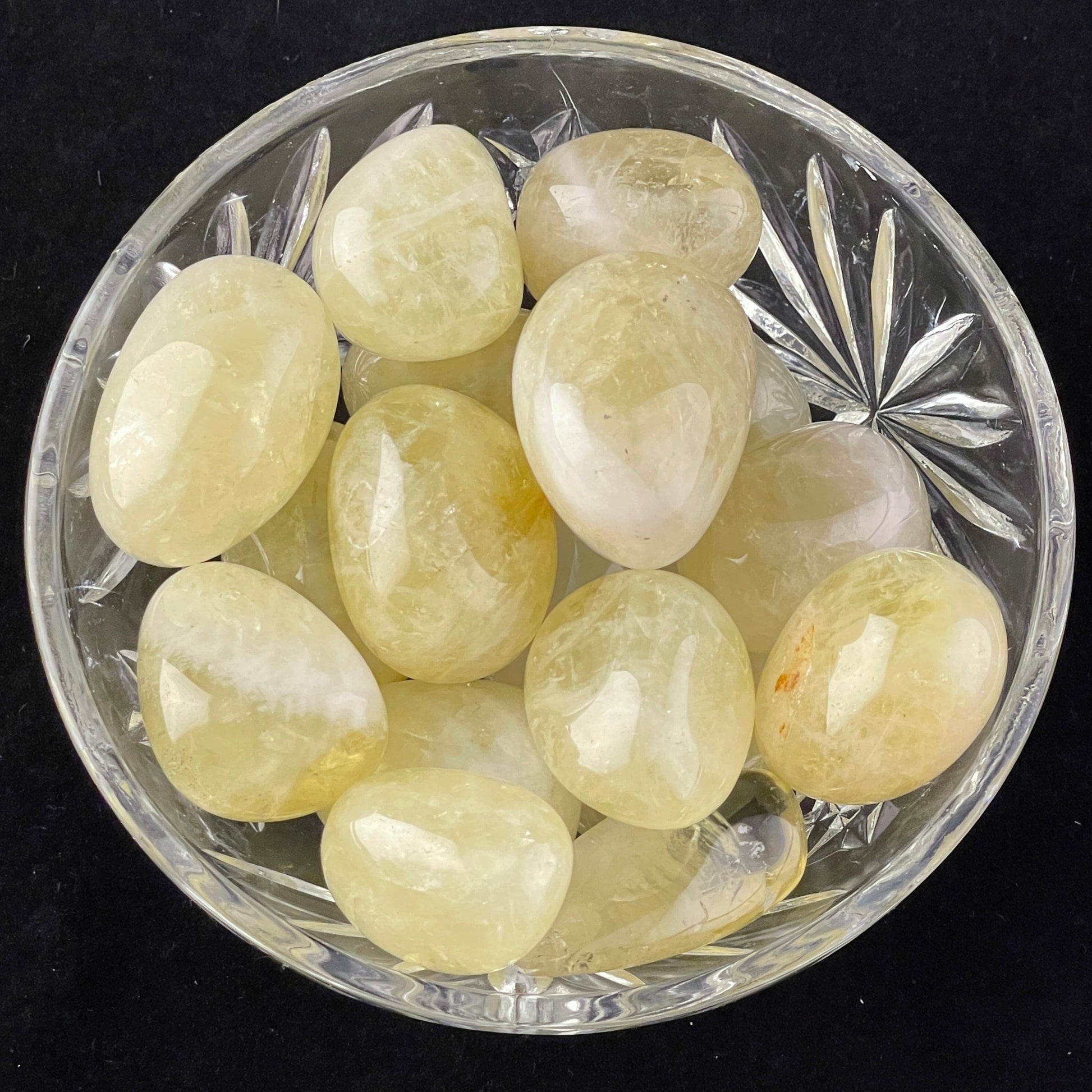 Lemon Citrine tumbled stone, pale golden-yellow, translucent