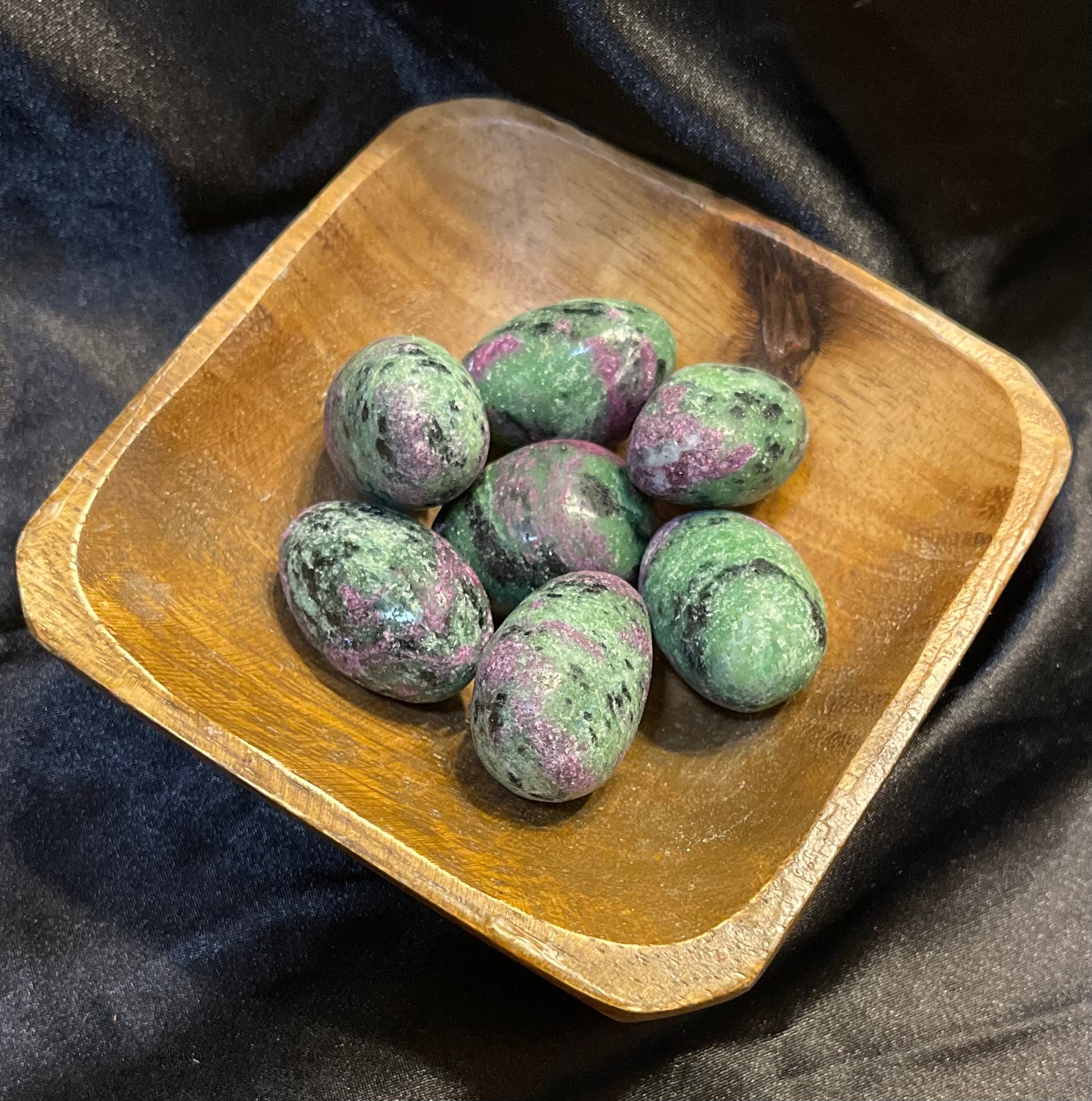 Ruby in Zoisite tumbled stone, green zoisite with rough red ruby and black flecks