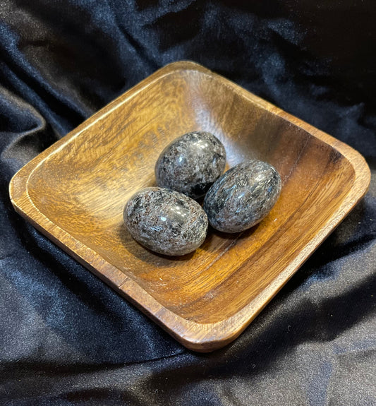 Arfvedsonite tumbled stone, deep black with a blue-grey iridescent flash
