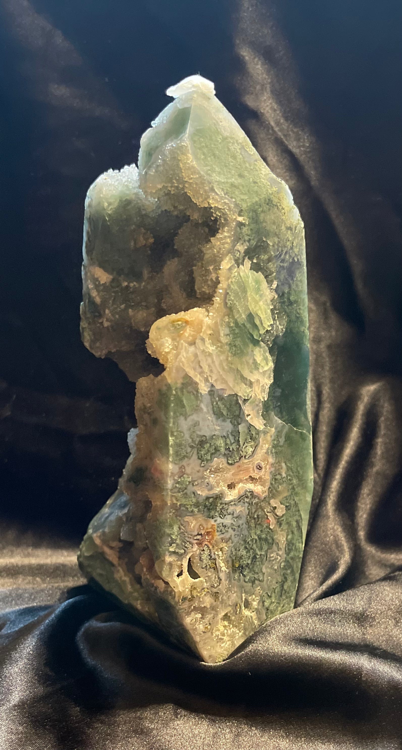 Moss Agate Druzy crystal tower, held in hand for scale