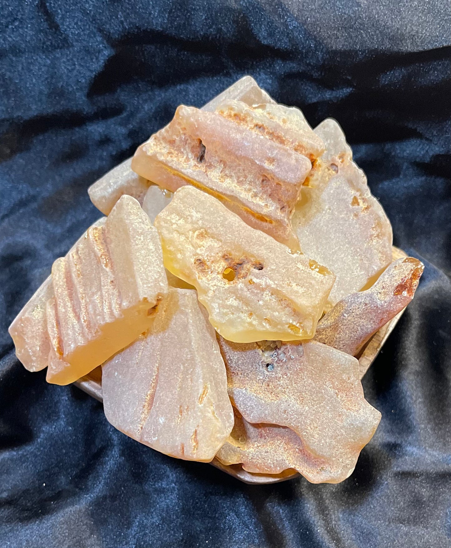 Columbian Amber Raw raw crystal specimen, shown against a dark backdrop